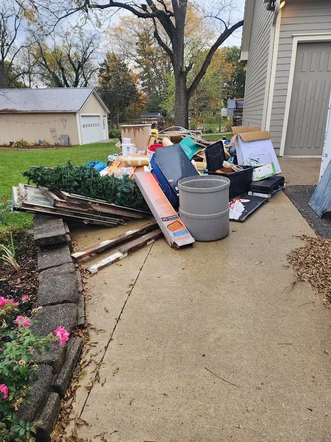 Dumpster being loaded with debris for Roofing Dumpster Rental in Hollister